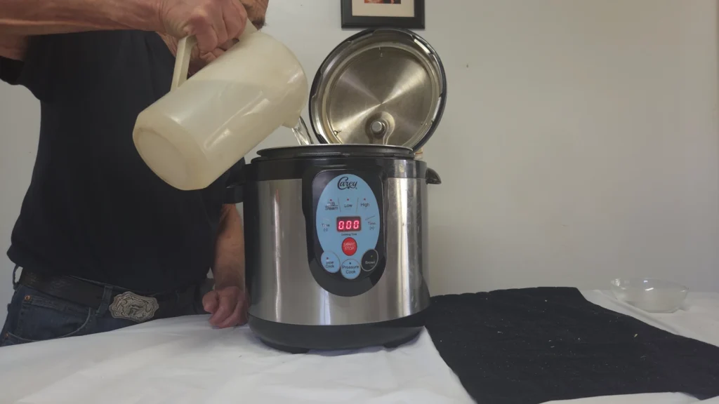 adding water to the  canner