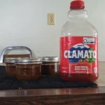 Clamato Juice beside jars of canned moose