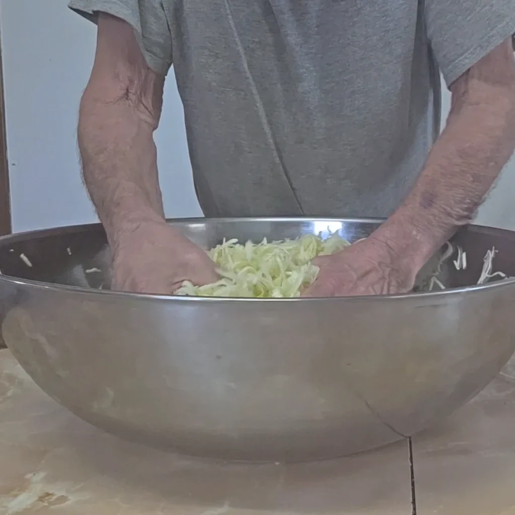 Mixing and crushing the cabbage