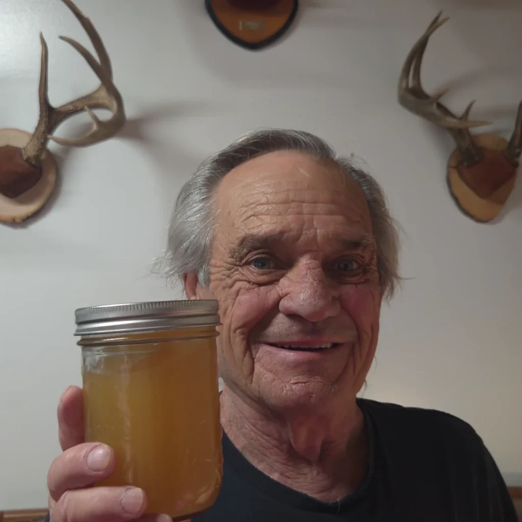 Holding a jar of canned chicken stock
