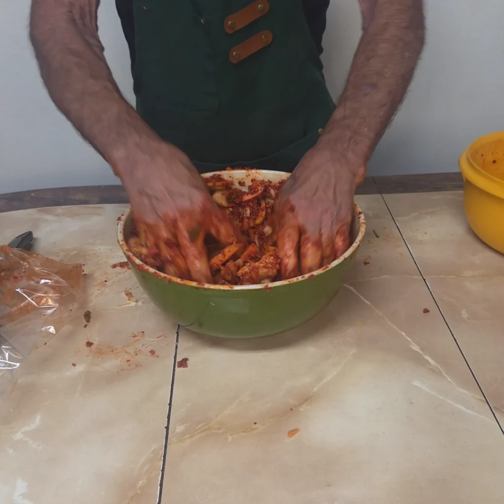 Mixing the paste into the vegetables