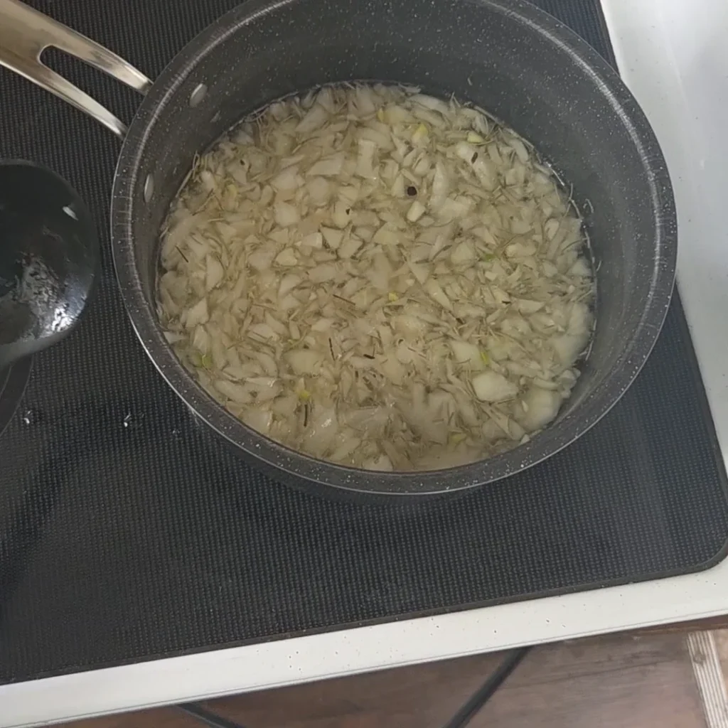 Onion an wine mixture on the stove