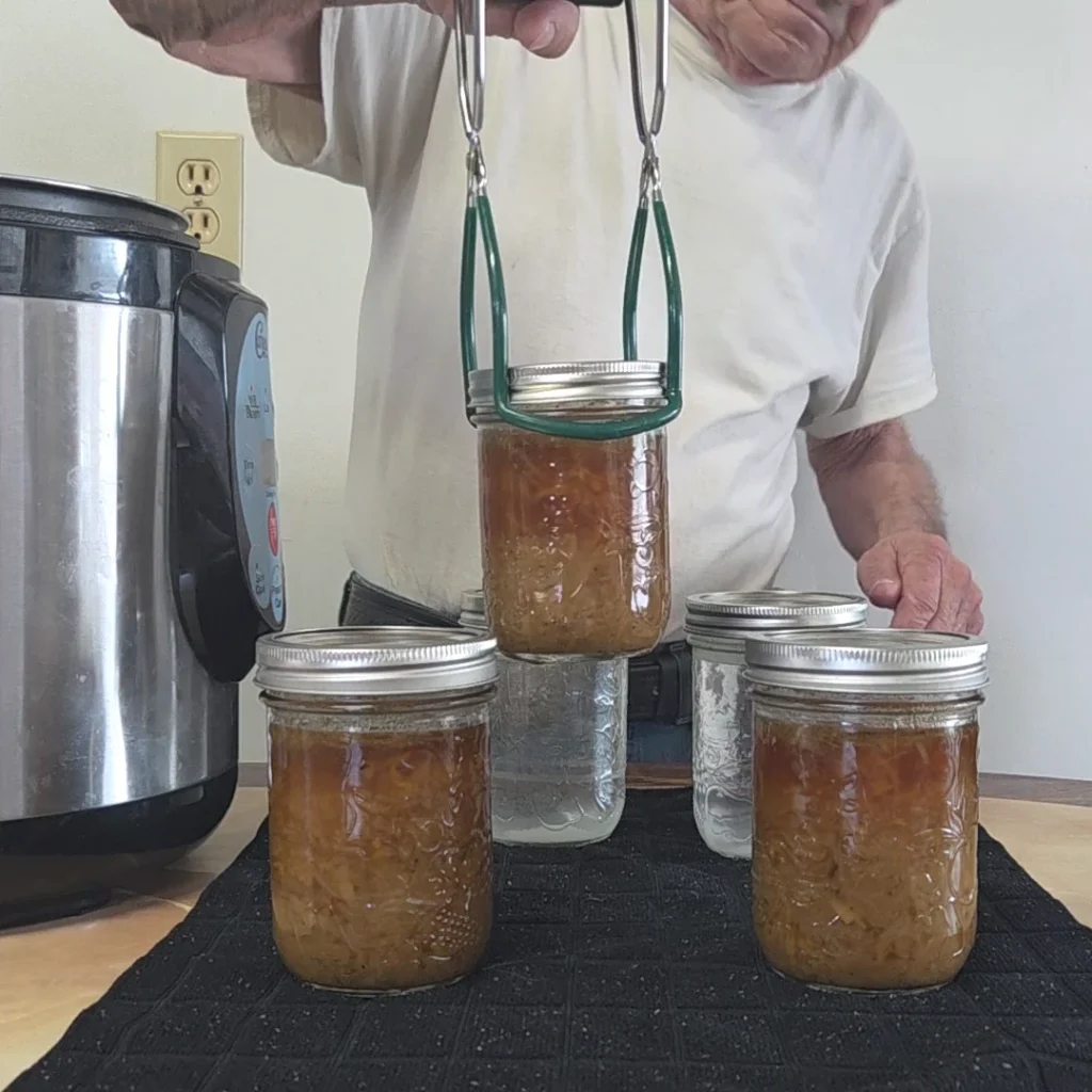 Pulling the third jar from the canner