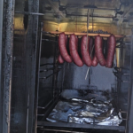 Sausage hanging in the smoker