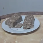 Two blocks of head cheese on a plate
