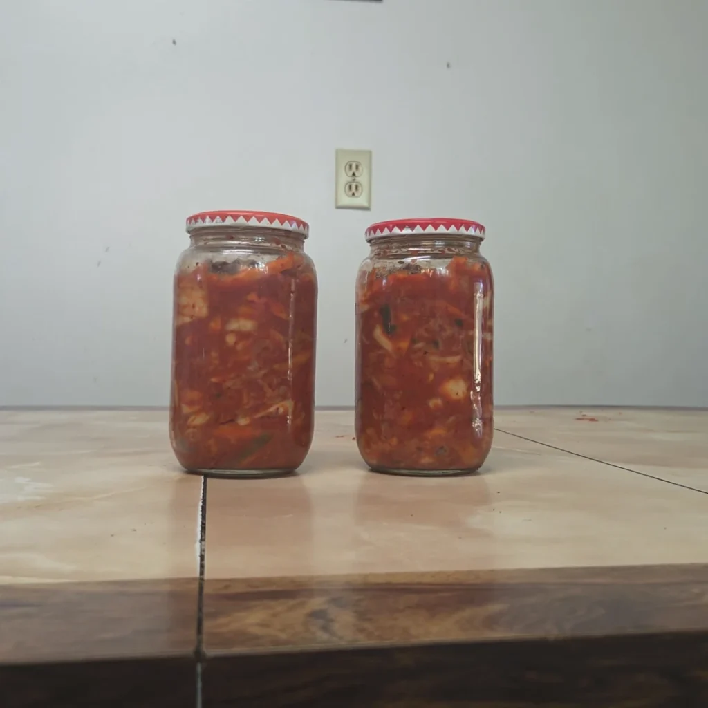 2 jars of kimchi on the table