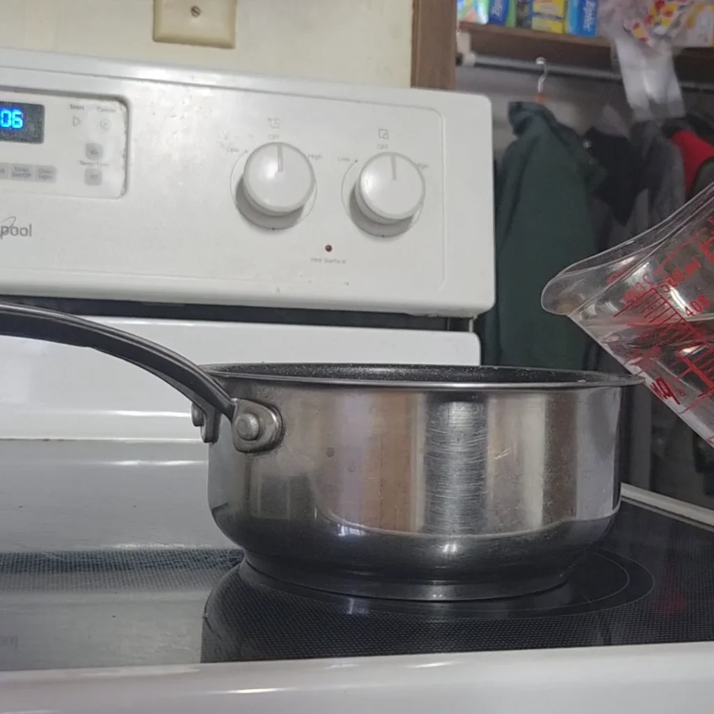 add spice bag and vinegar to a pot