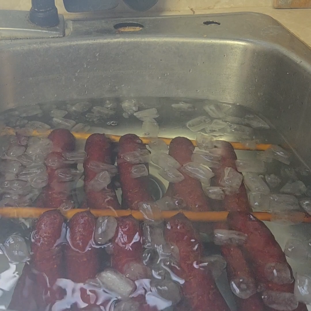Sausage links are in ice water
