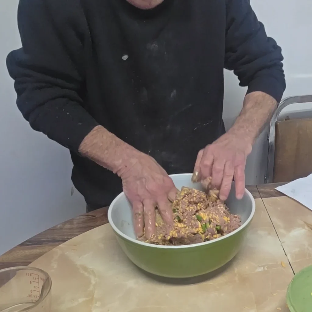 Mixing the spices with the meat