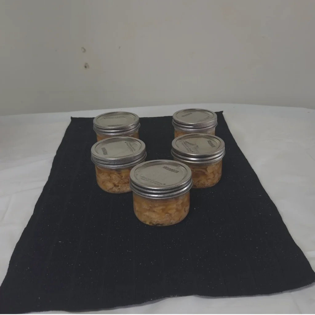 finished jars of chicken on the table