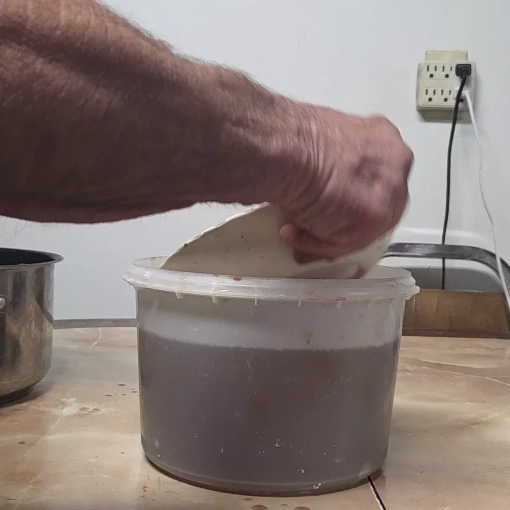 weigh the ham down with a bowl
